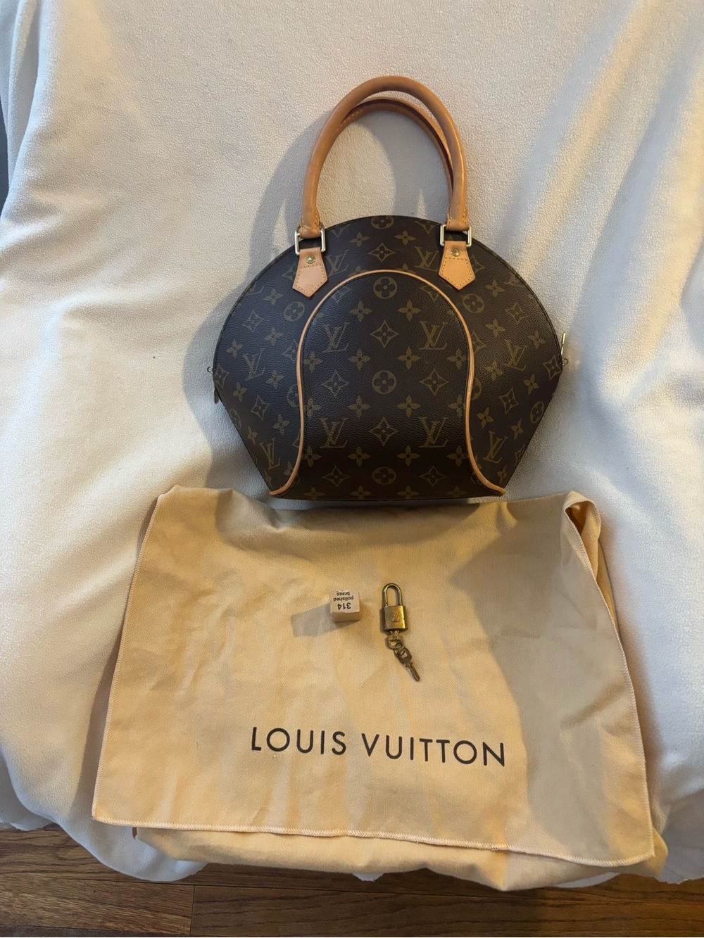 Louis Vuitton Monogram Alma PM Satchel in Brown with Vachetta Trim